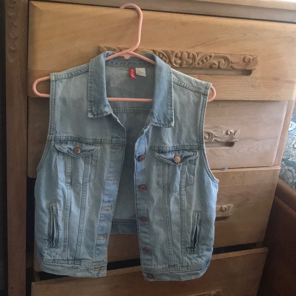Never worn, light wash blue jean vest